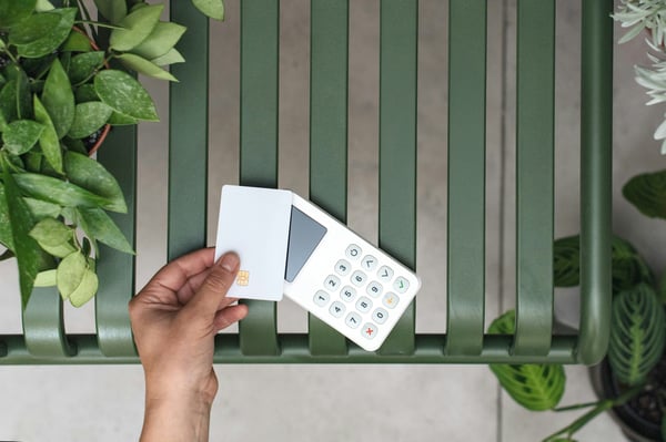 Credit card and POS machine. Photo by Mockuuups on Unsplash